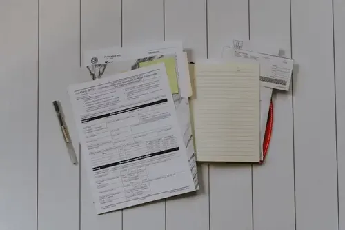 A calculator and charts representing financial strategy.